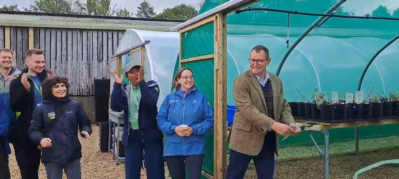 Image of our Chair, Dr Dave Beaumont alongside team members of the Countryside Trust and special guests who attended the official launch and ribbon cutting ceremony of the Lomond Plant Nursery in Gartocharn.